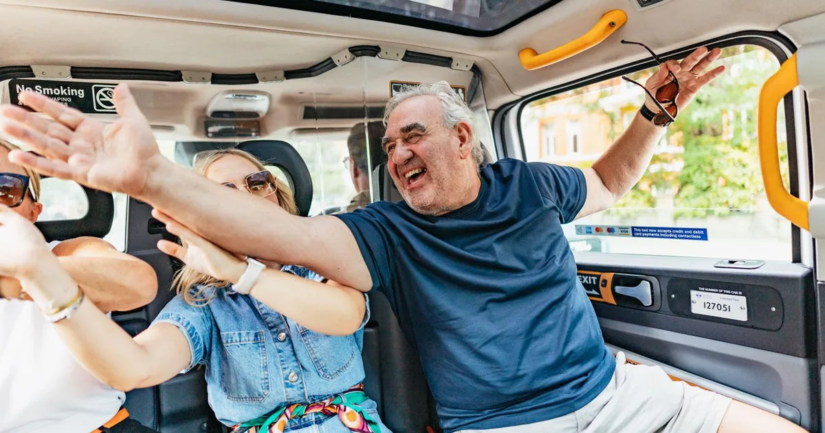 Guests laughing on the rear seats of a London taxi with a glass roof during a private music tour